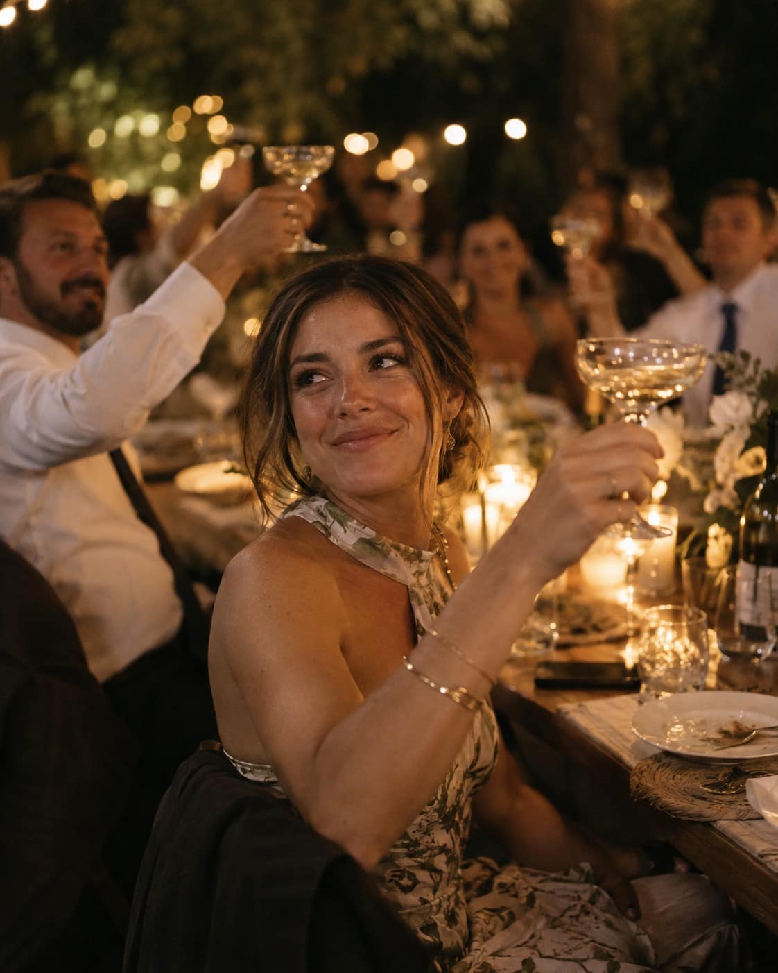 Guest raising a glass during an event dinner