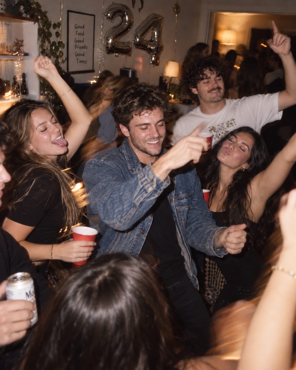 Friends dancing together at a birthday celebration